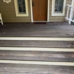 A front porch in need of staining