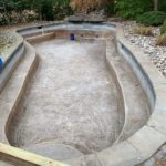 A like-new concrete pool after pressure washing