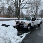 One of our trucks handling snow removal with a plow